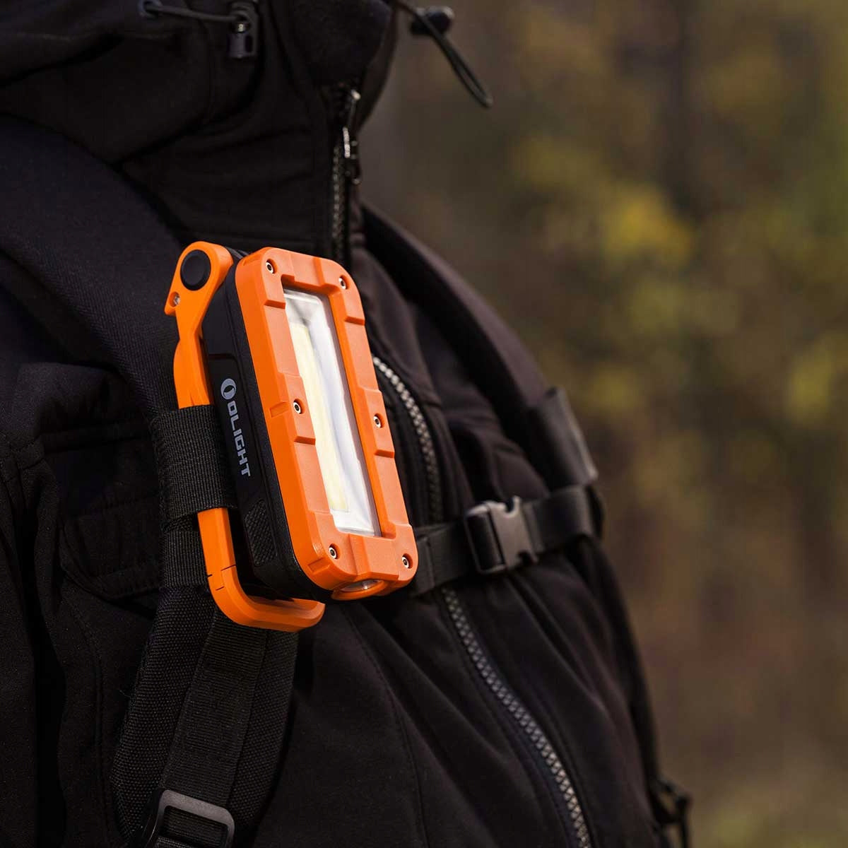 Lampa Olight Swivel Pro Orange - 1100 lumenów do samochodu / majsterkowania