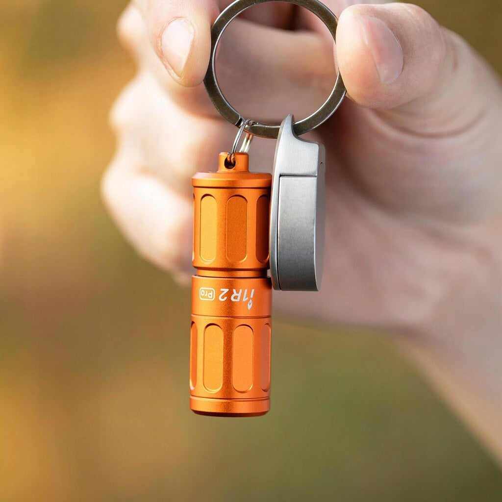 Latarka miniaturowa Olight i1R 2 Pro Capsule pomarańczowa 180lm 48m 12 min